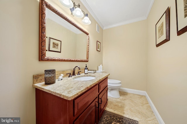 bathroom featuring vanity, crown molding, and toilet