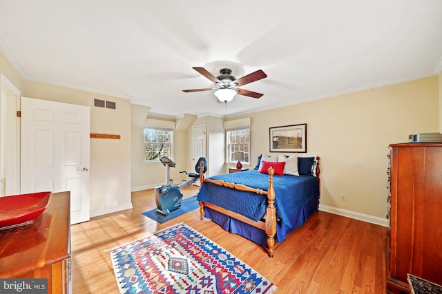 bedroom with ceiling fan, wood-type flooring, and ornamental molding