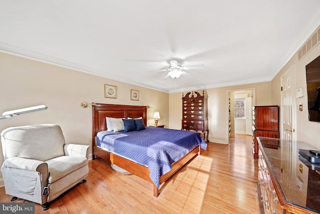 bedroom featuring light wood-type flooring, crown molding, and ceiling fan