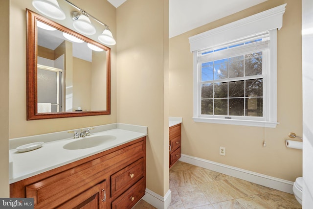 bathroom featuring vanity and an enclosed shower