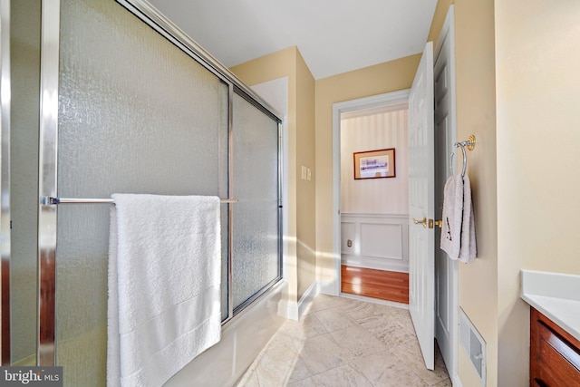 bathroom with vanity and walk in shower