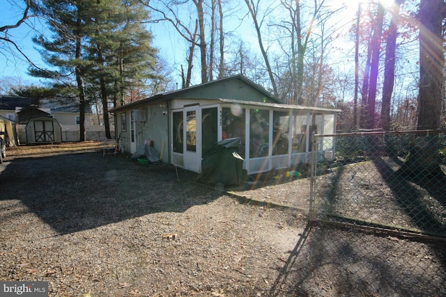 view of home's exterior with a sunroom