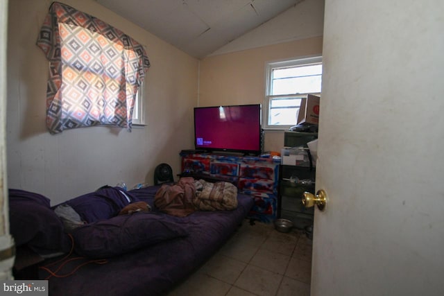 tiled living room featuring lofted ceiling