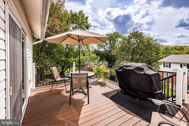 wooden deck featuring grilling area