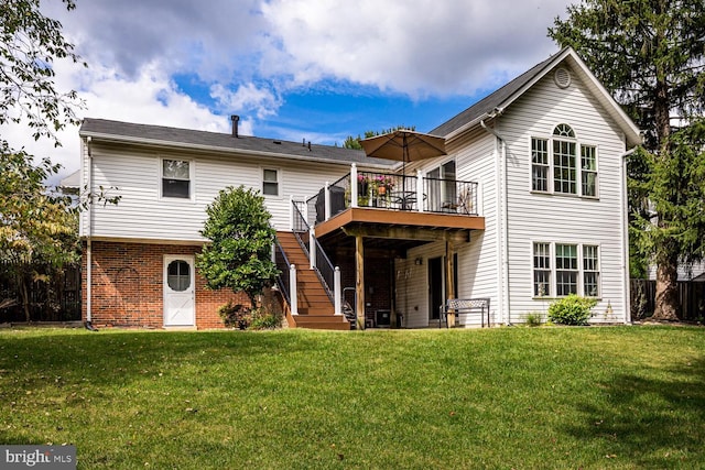 back of property with a deck and a lawn