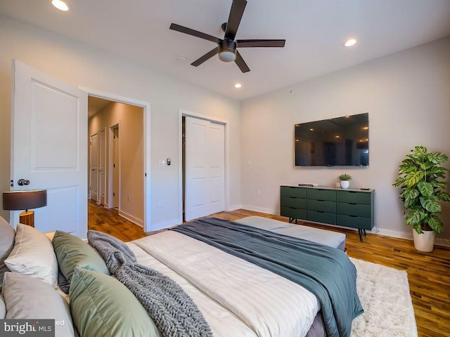 bedroom featuring hardwood / wood-style flooring and ceiling fan