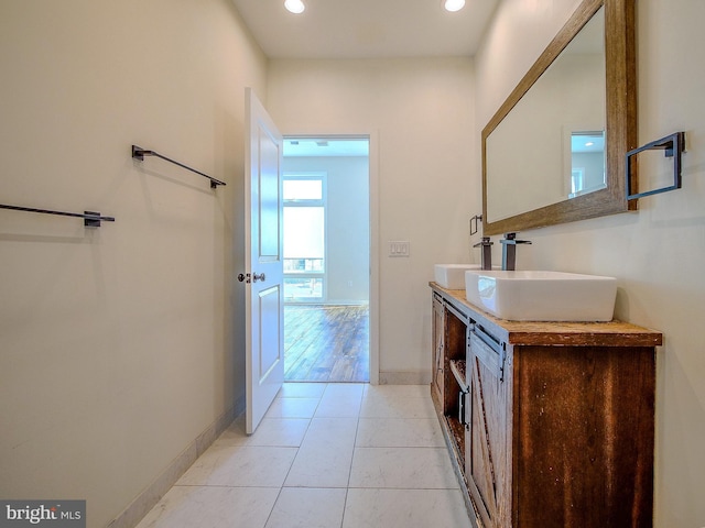 bathroom with tile patterned flooring and vanity