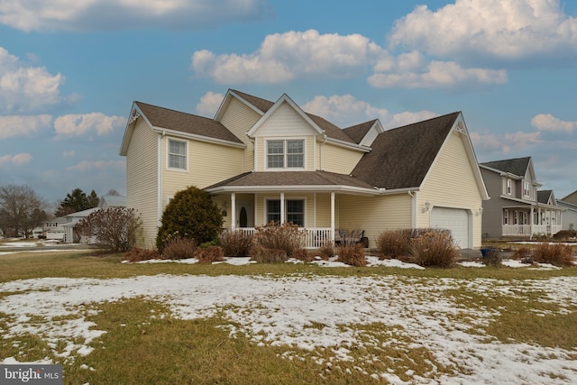 view of front facade featuring a porch and a garage