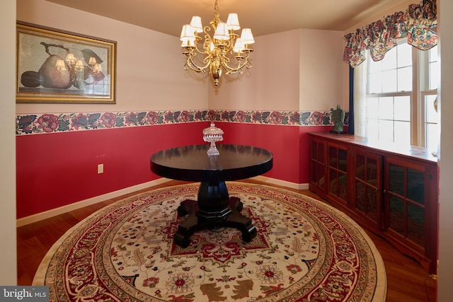 dining space featuring a chandelier and hardwood / wood-style floors