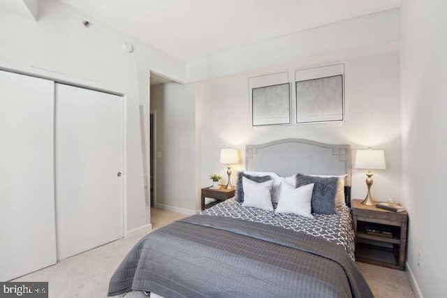 carpeted bedroom featuring a closet