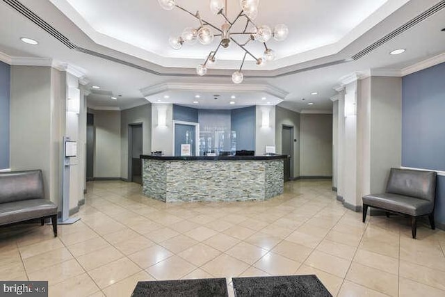 reception area featuring bar area and a chandelier