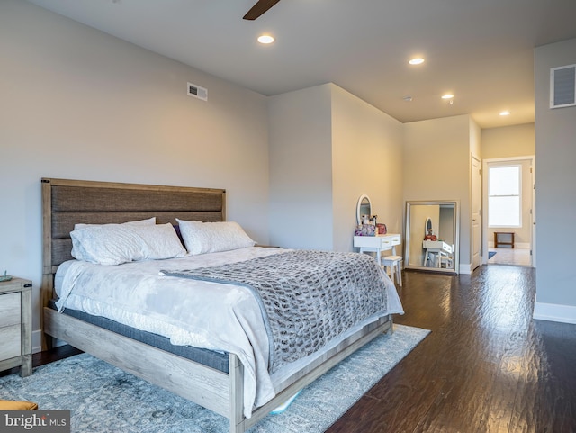 bedroom with dark wood-type flooring