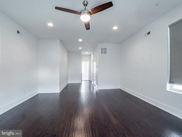 unfurnished room featuring ceiling fan and dark hardwood / wood-style flooring