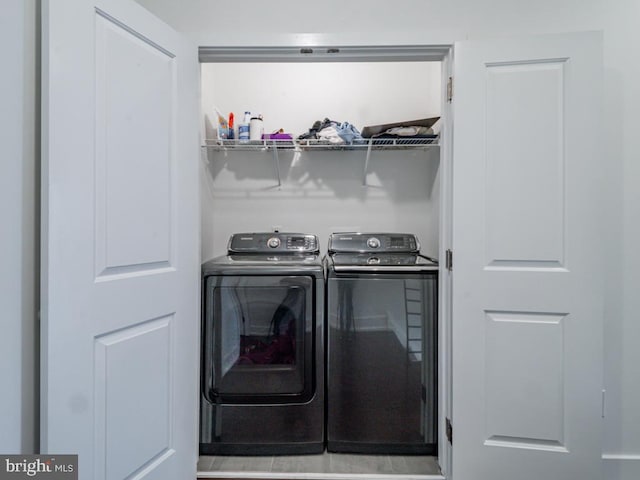 washroom featuring washer and dryer