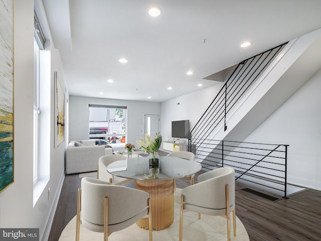 dining space featuring hardwood / wood-style floors