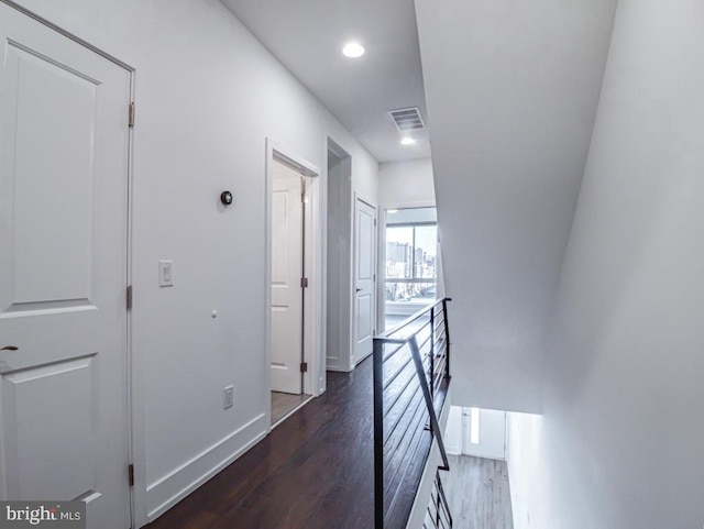 corridor with dark wood-type flooring