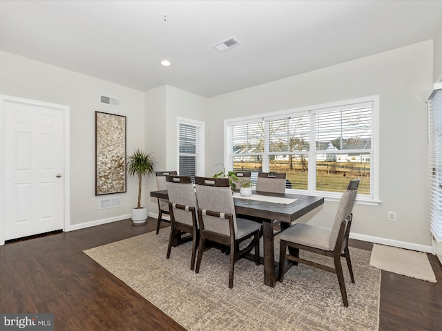 dining area featuring dark hardwood / wood-style floors