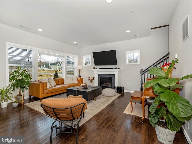 living room with dark hardwood / wood-style flooring