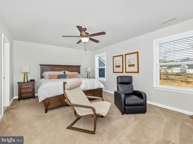 bedroom with light colored carpet and ceiling fan