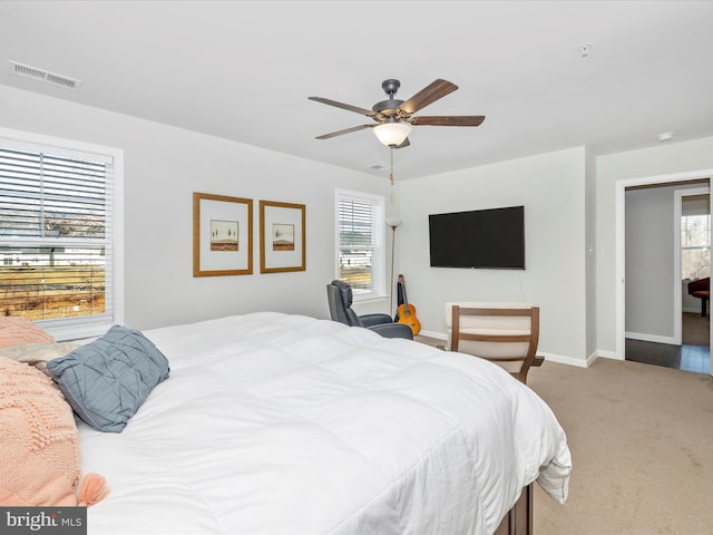 carpeted bedroom featuring ceiling fan