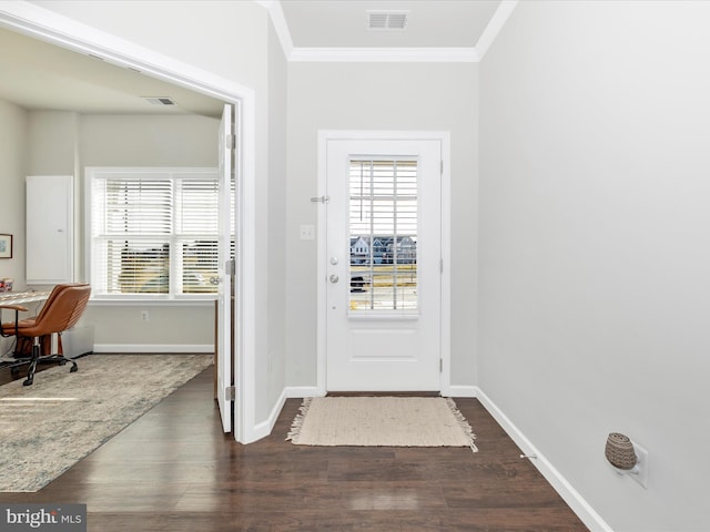 doorway to outside with dark wood-type flooring, a healthy amount of sunlight, and ornamental molding