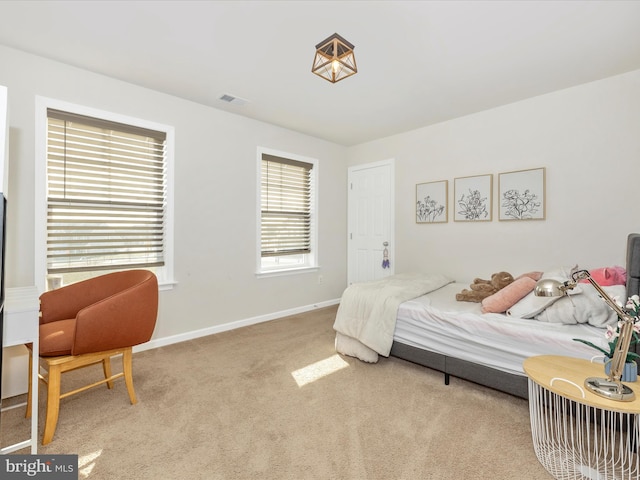 bedroom with light carpet