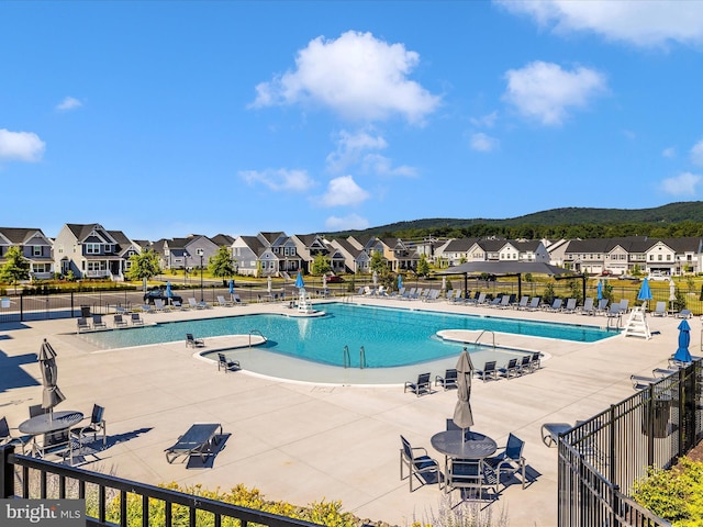 view of swimming pool with a patio