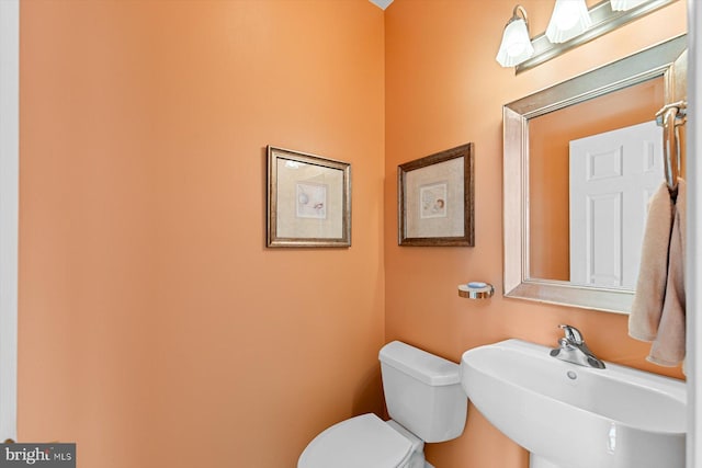 bathroom featuring sink and toilet