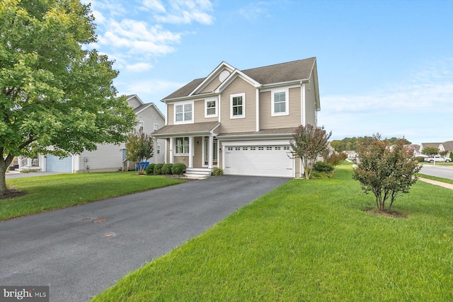 view of front of home with a garage and a front lawn