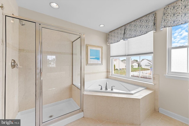 bathroom with tile patterned floors and independent shower and bath