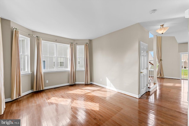 spare room with light hardwood / wood-style floors