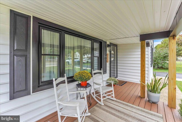 wooden deck with a porch