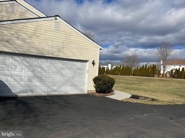 garage featuring a yard