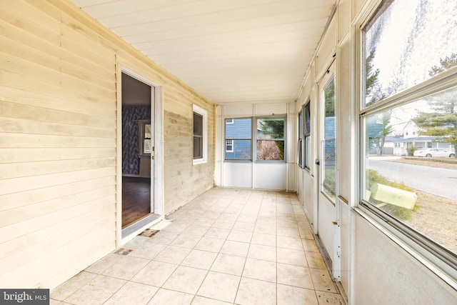 unfurnished sunroom with a healthy amount of sunlight