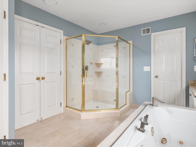 full bathroom with tile patterned floors, visible vents, a shower stall, and a whirlpool tub