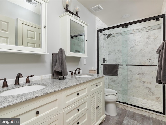 full bathroom with a shower stall, visible vents, and a sink