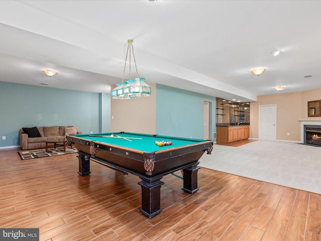 game room with baseboards, a fireplace with flush hearth, light wood-style floors, and billiards