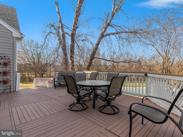 deck featuring outdoor dining area