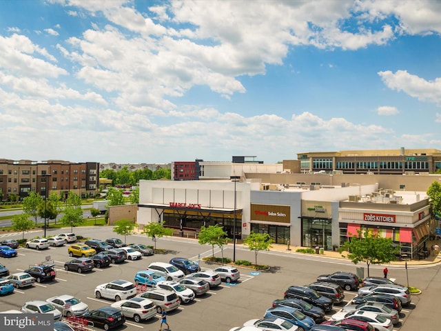 view of building exterior featuring uncovered parking