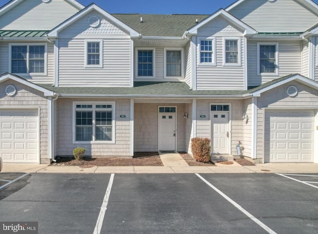 townhome / multi-family property featuring a garage