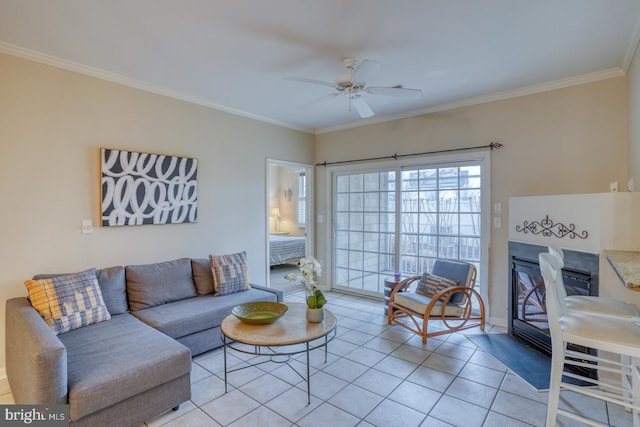 living room with crown molding, ceiling fan, and light tile patterned floors