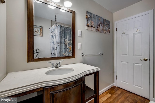 bathroom featuring vanity and wood-type flooring