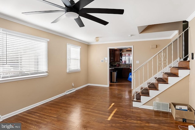 foyer featuring crown molding, ceiling fan, and dark hardwood / wood-style floors