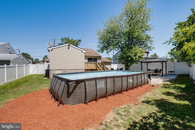 view of swimming pool featuring a yard and a gazebo