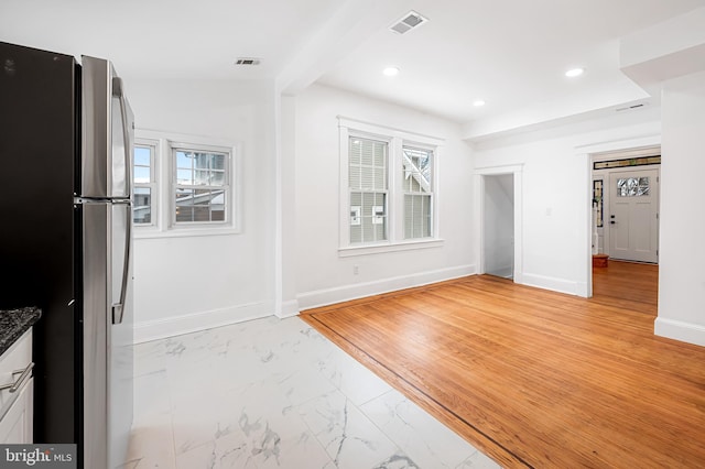 interior space featuring beam ceiling