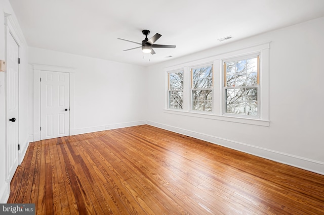 unfurnished room with ceiling fan and wood-type flooring