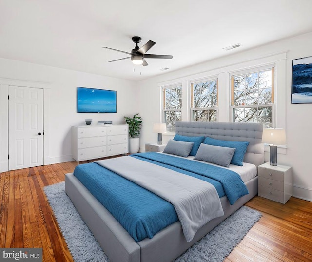 bedroom featuring hardwood / wood-style floors and ceiling fan