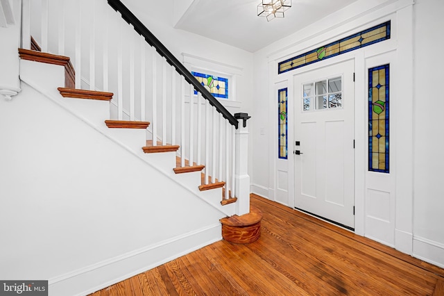 entryway with hardwood / wood-style flooring