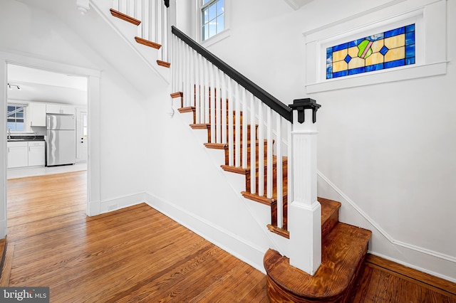 staircase featuring hardwood / wood-style floors