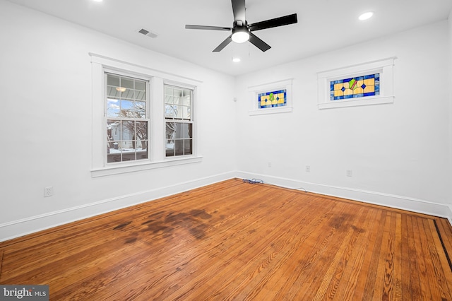 empty room featuring hardwood / wood-style floors and ceiling fan